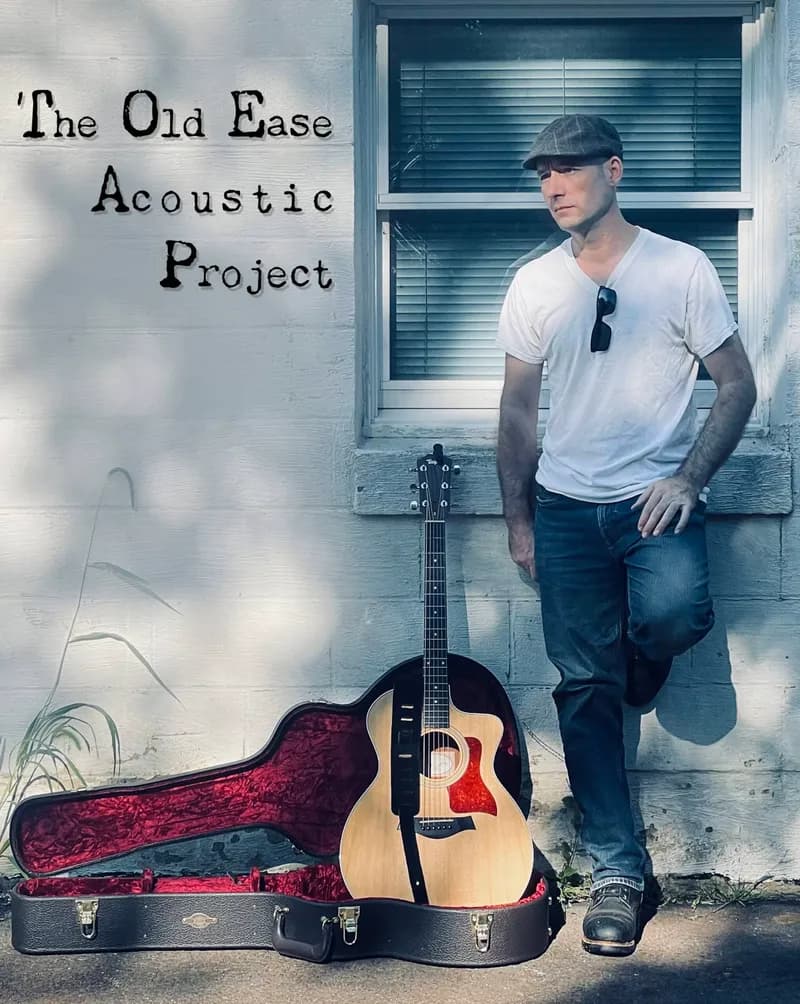 The Old Ease Acoustic Project event poster — guitarist leaning against a wall beside his guitar case