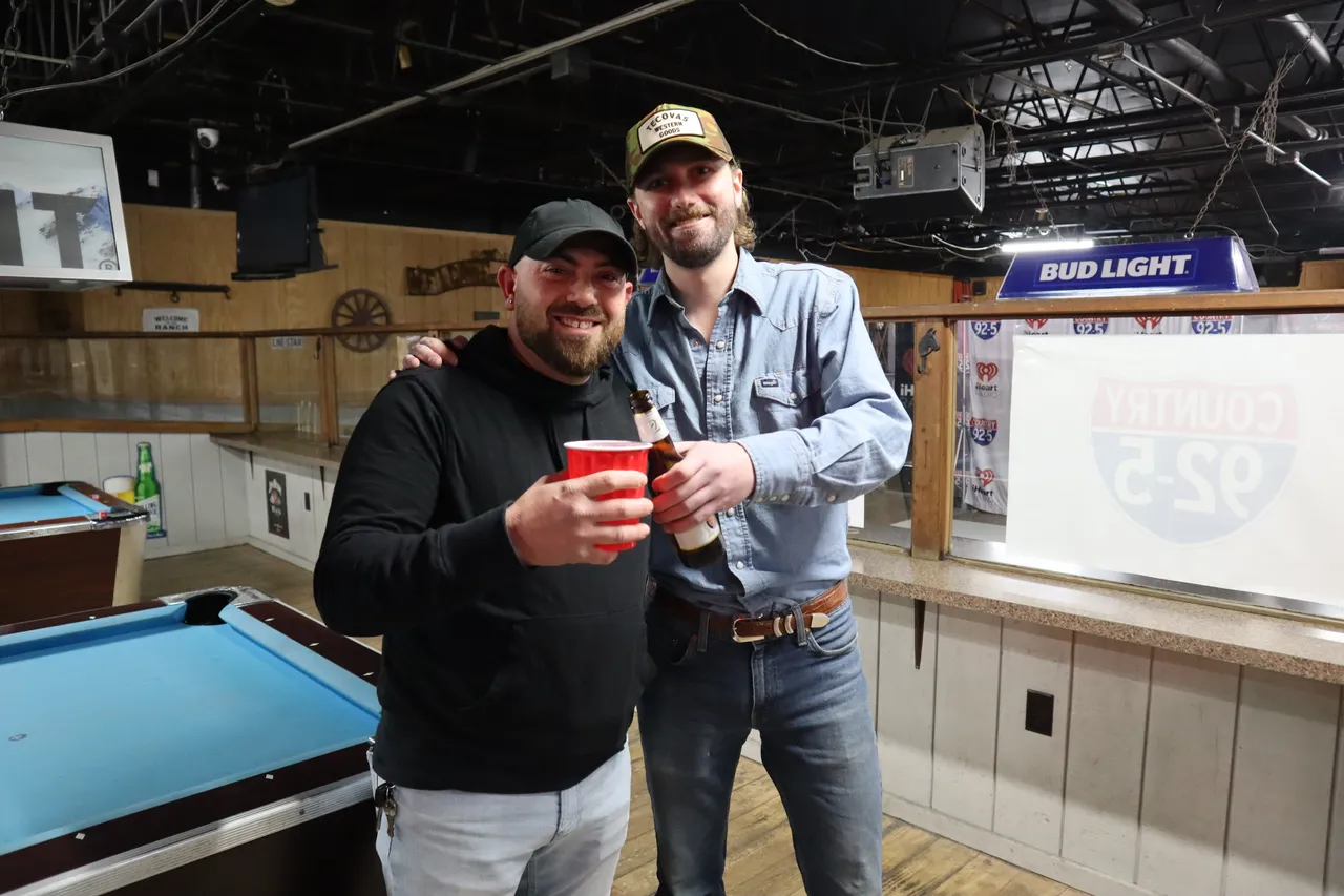Guys grabbing drinks at the Cadillac Ranch bar