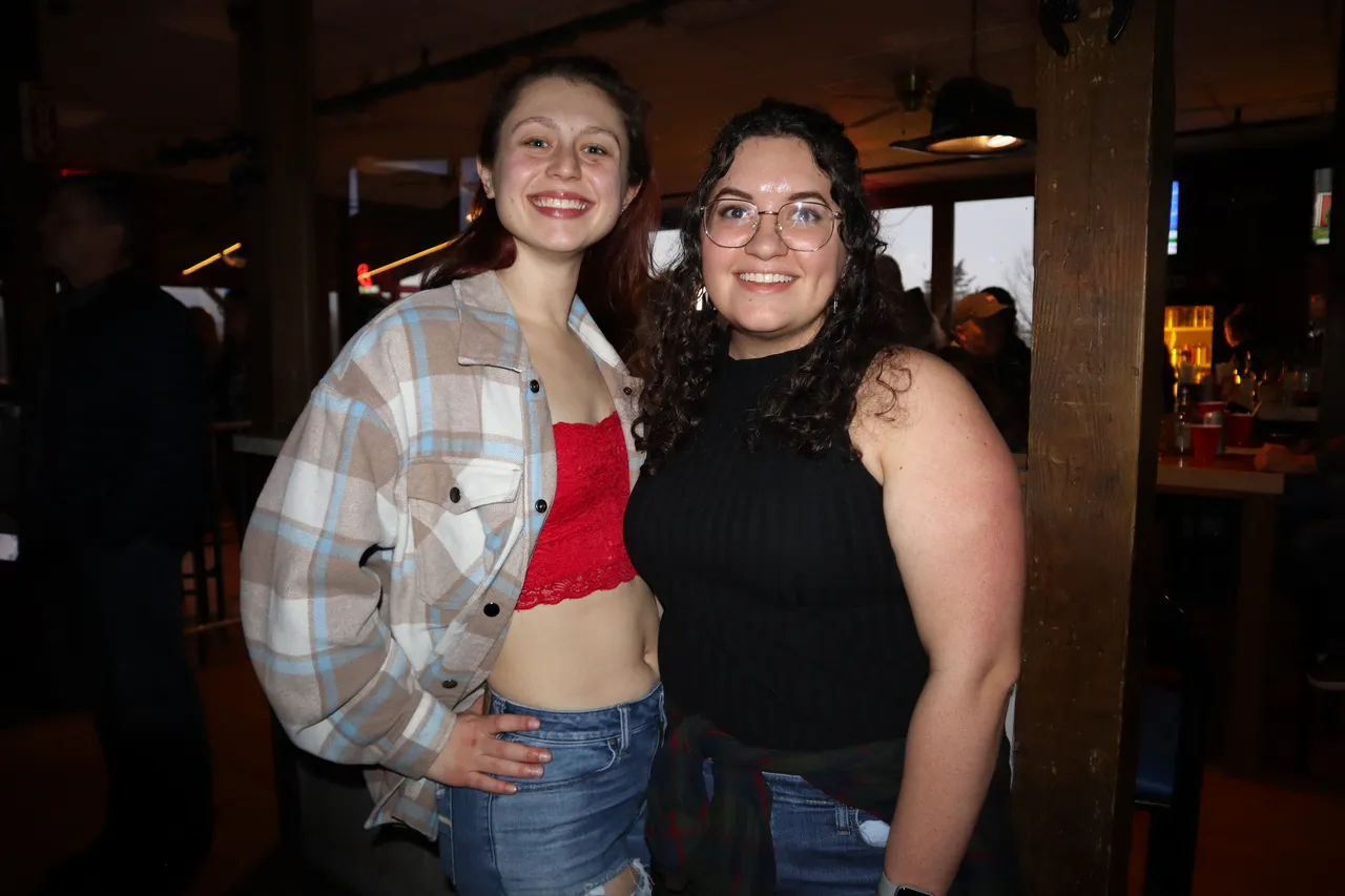 Two friends smiling at Cadillac Ranch
